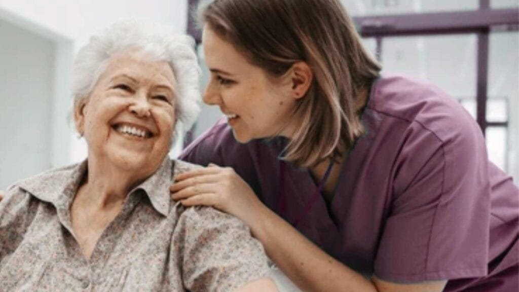 Compassionate caregiver providing emotional support to senior at home